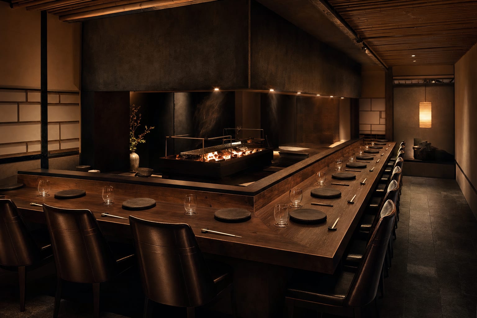 The dark hinoki counter of SUMI, lit by paper lanterns